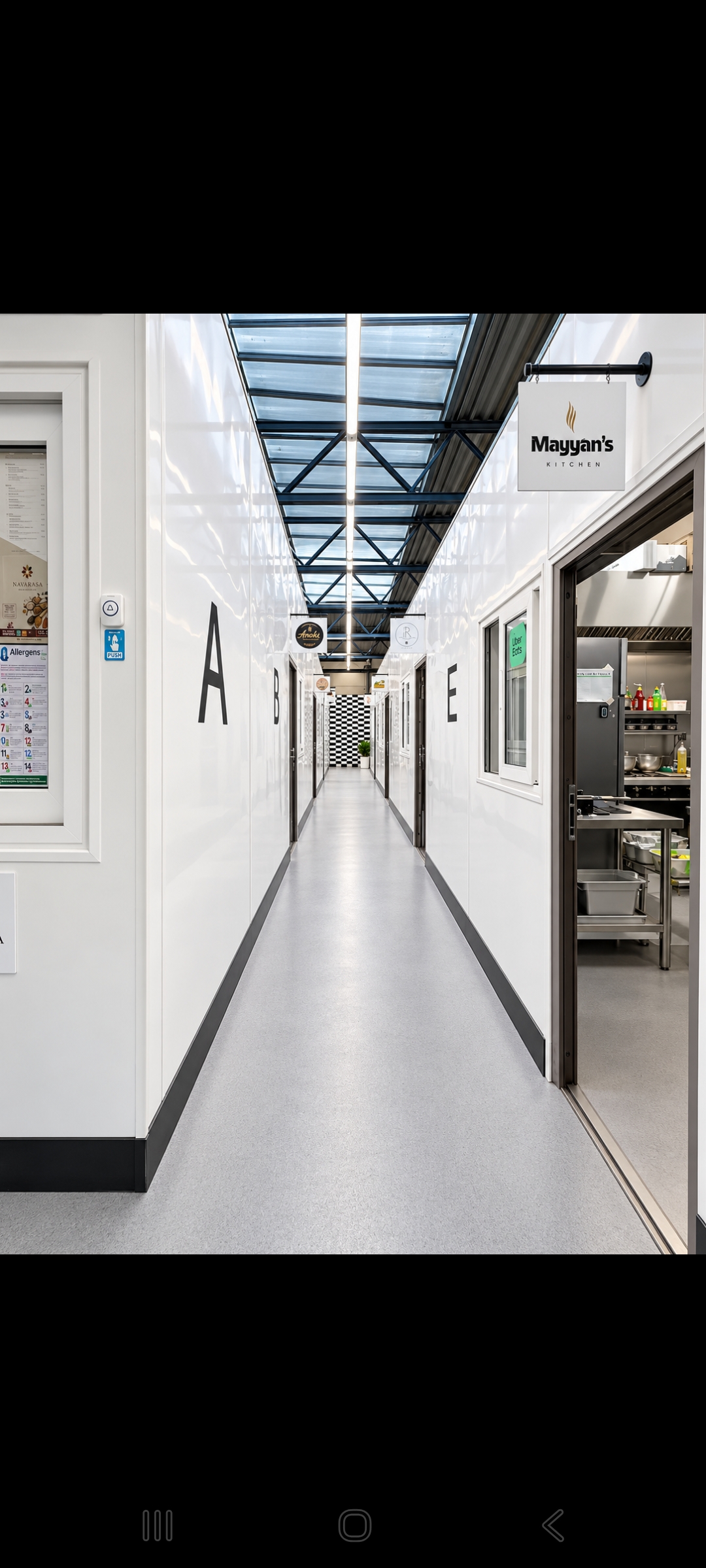 Foody Kitchenz internal corridor with open commercial kitchen